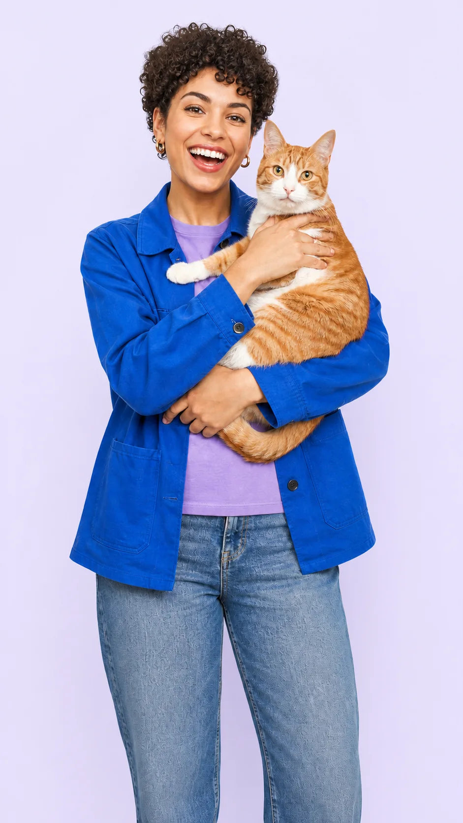 Pet owner sharing a happy moment with an orange-and-white cat